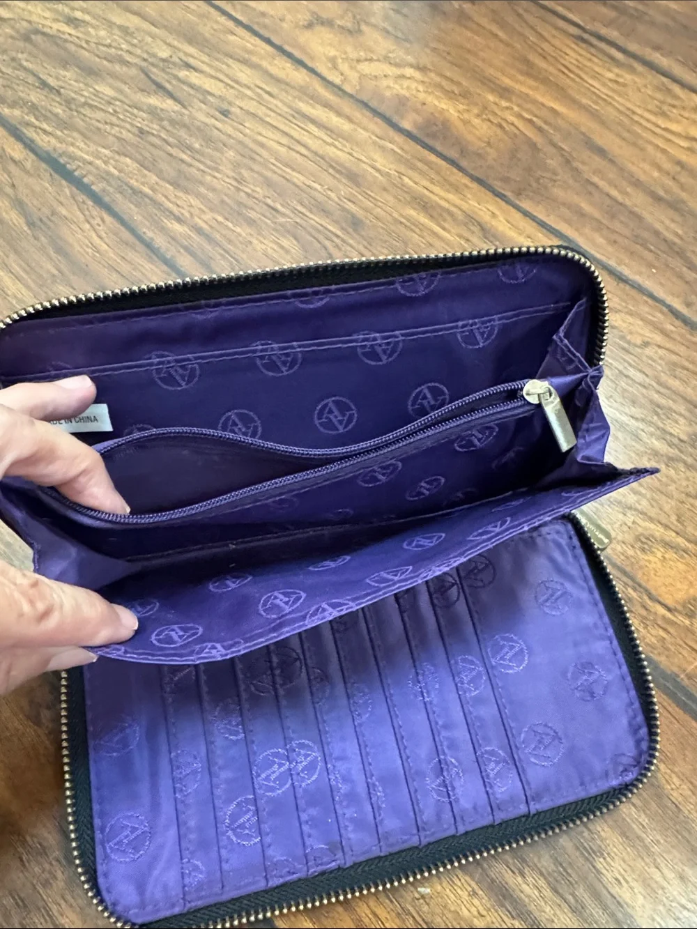 Adrienne Vittadini Black Zip Around Wallet Purple Interior Pebbled